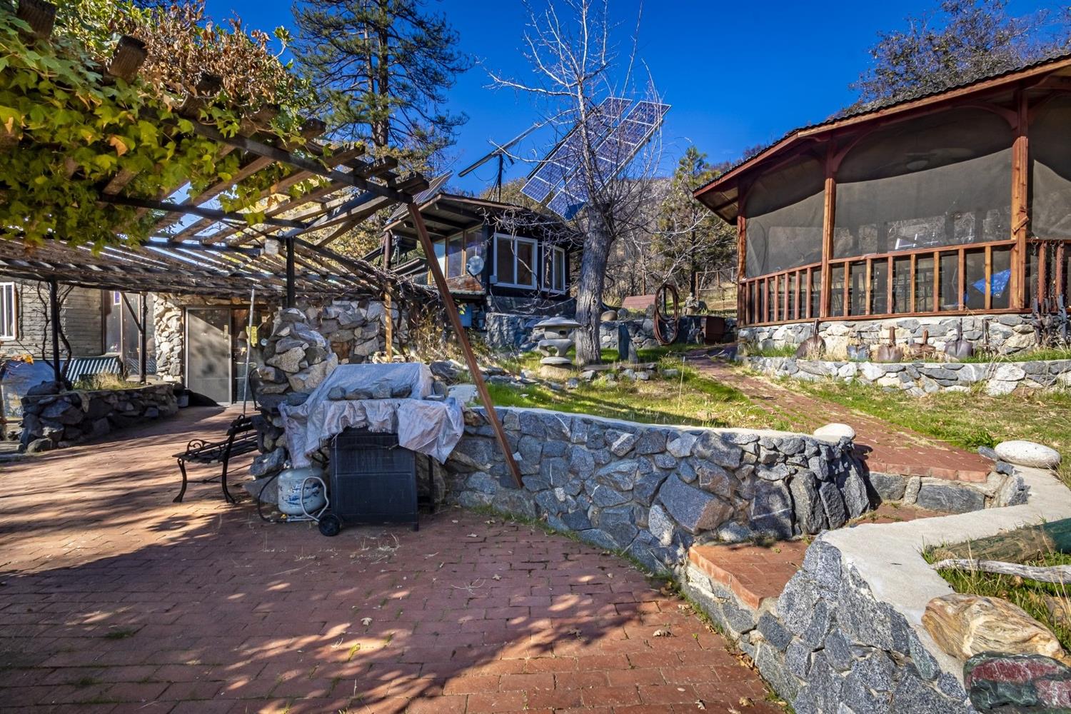 32100 Kinsman Flat Road North Fork, CA 93643 - Photo 32 of 62 a view of a fountain with swimming pool in back yard