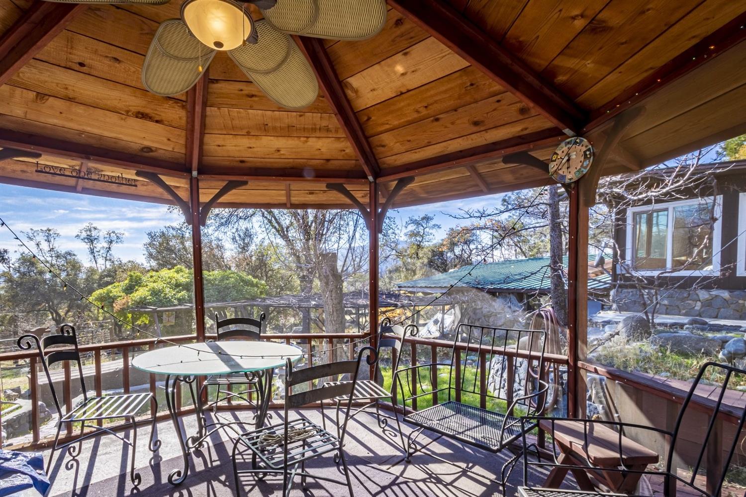 32100 Kinsman Flat Road North Fork, CA 93643 - Photo 33 of 62 a view of a patio with a table chairs and a table