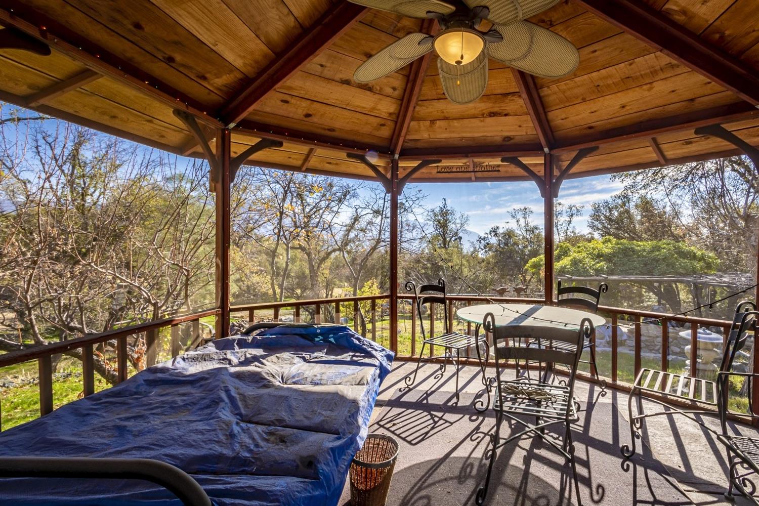 32100 Kinsman Flat Road North Fork, CA 93643 - Photo 34 of 62 a view of a balcony with couch and wooden floor