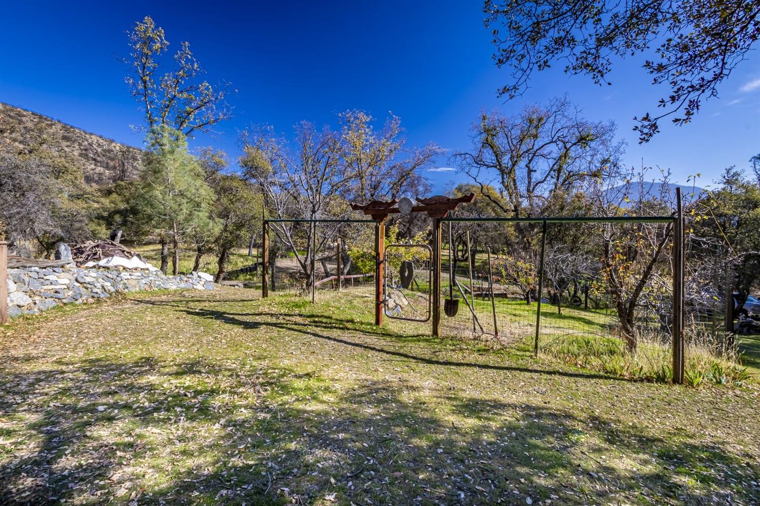 32100 Kinsman Flat Road North Fork, CA 93643 - Photo 44 of 62 a view of swimming pool with a yard