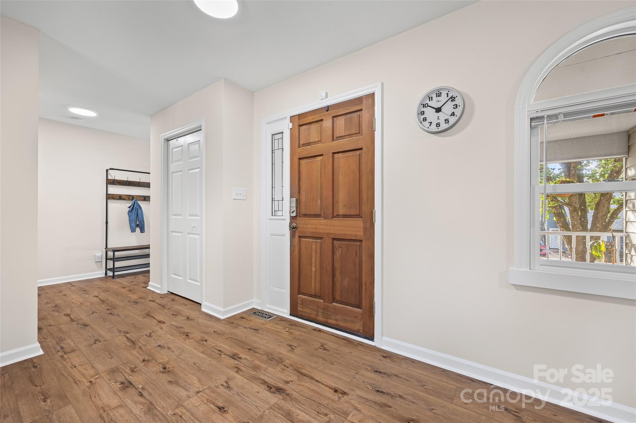 9013 Windjammer Drive Tega Cay, SC 29708 - Photo 15 of 20 a view of a refrigerator in kitchen and wooden floor