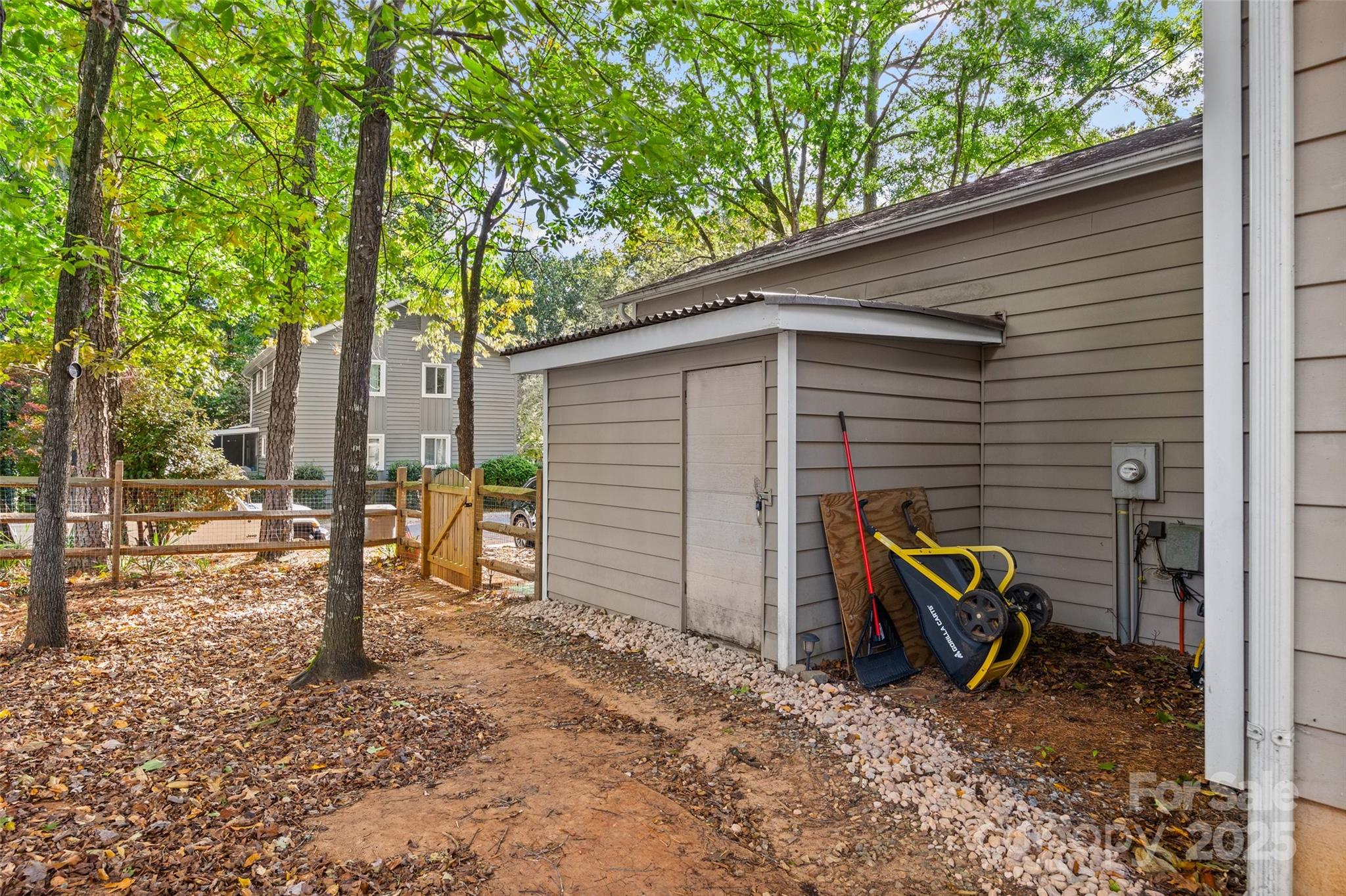 9013 Windjammer Drive Tega Cay, SC 29708 - Photo 17 of 20 a view of a house with backyard
