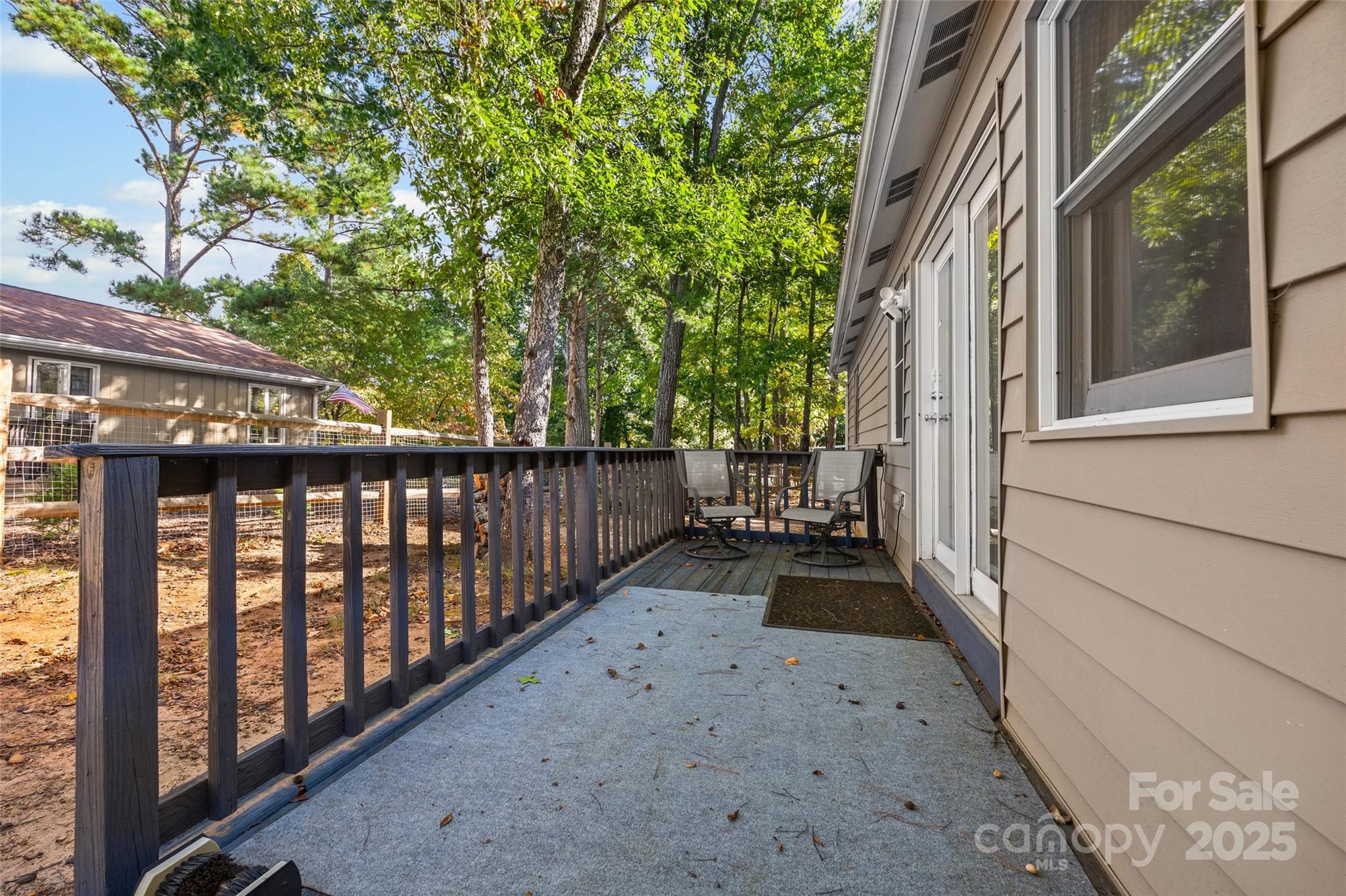 9013 Windjammer Drive Tega Cay, SC 29708 - Photo 18 of 20 a view of a pathway of a house with wooden floor