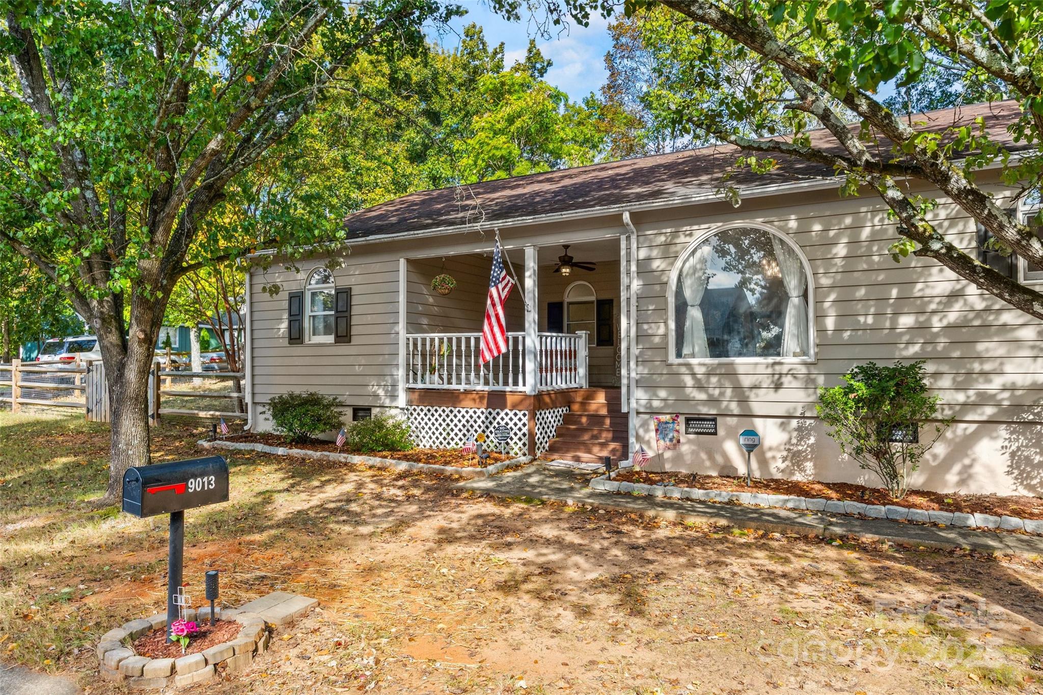 9013 Windjammer Drive Tega Cay, SC 29708 - Photo 2 of 20 a front view of a house with garden