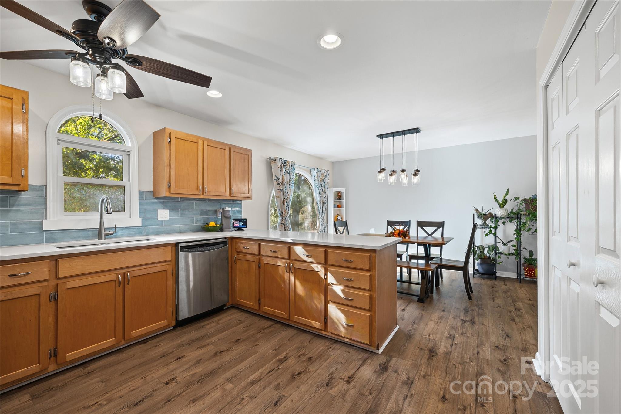 9013 Windjammer Drive Tega Cay, SC 29708 - Photo 5 of 20 a large kitchen with a table and chairs in it