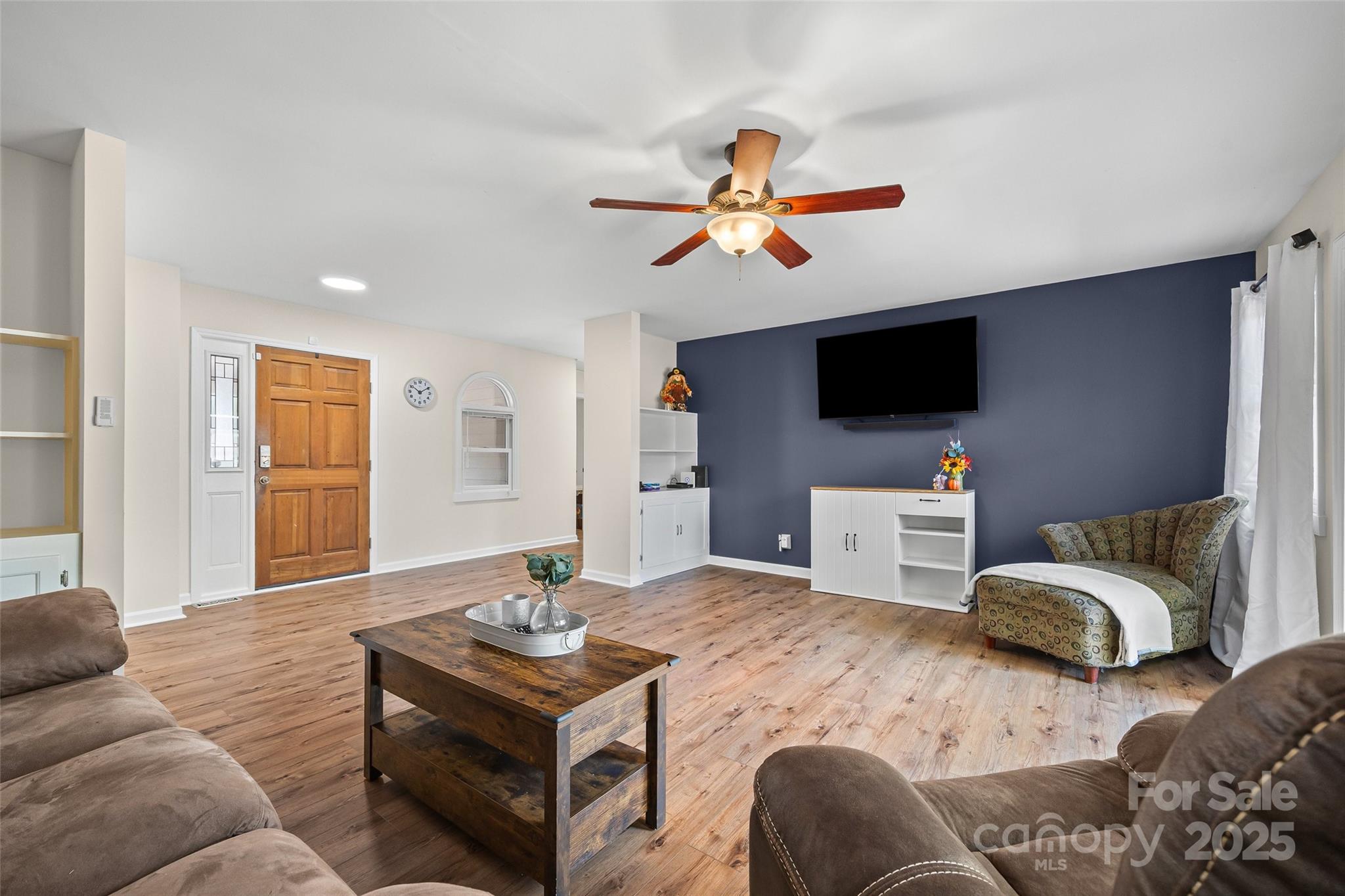 9013 Windjammer Drive Tega Cay, SC 29708 - Photo 7 of 20 a living room with furniture and a flat screen tv
