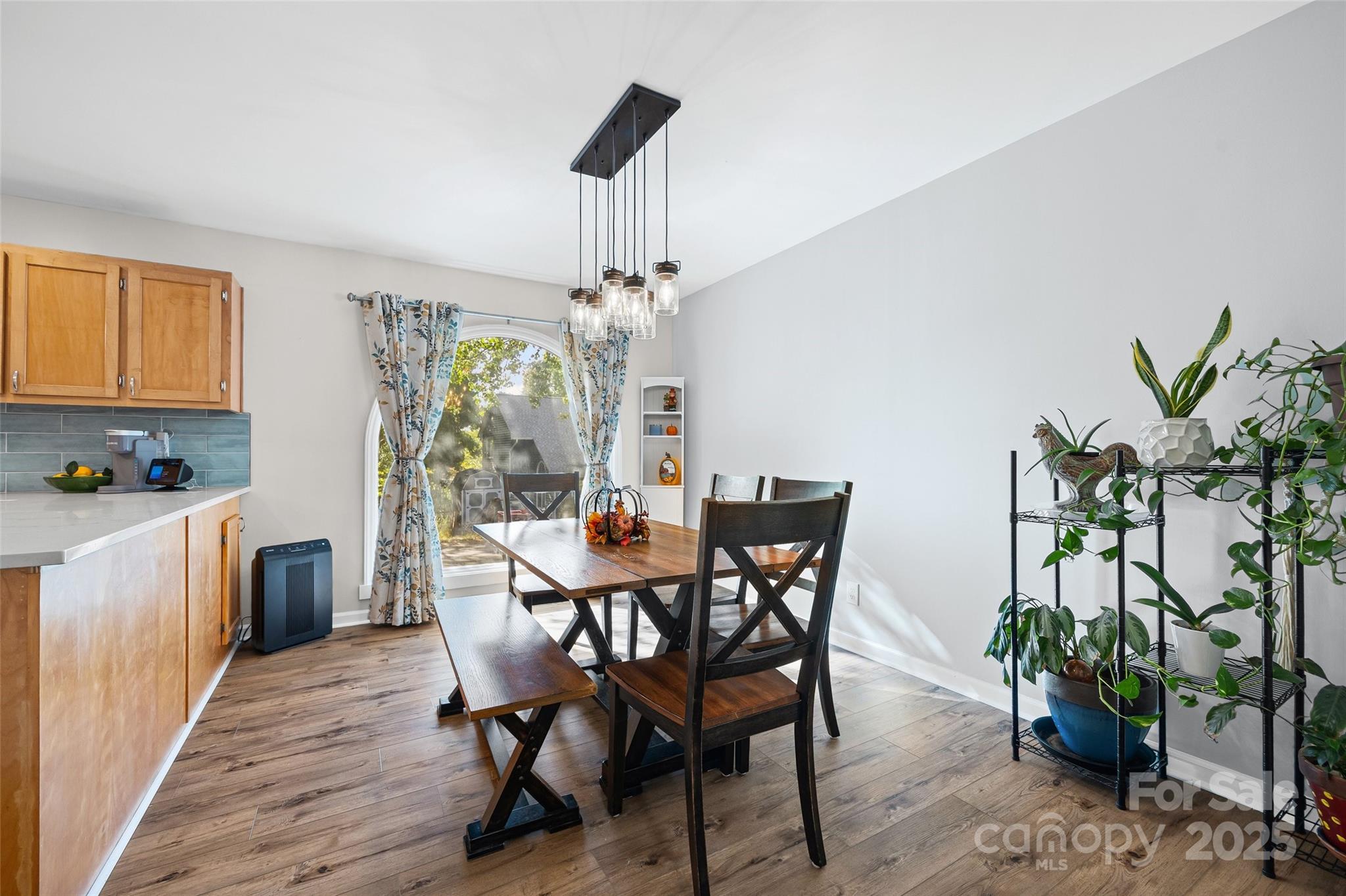 9013 Windjammer Drive Tega Cay, SC 29708 - Photo 9 of 20 a view of a dining room with furniture and chandelier