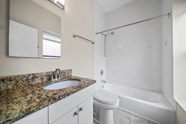 a bathroom with a sink a toilet and a bathtub