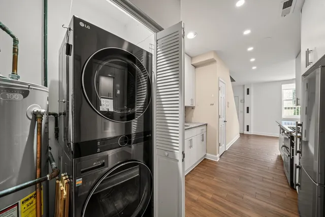 a view of a hallway with washer and dryer