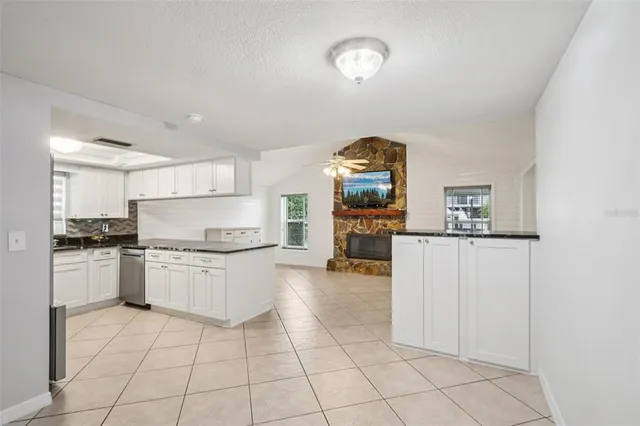 a kitchen with a stove a sink and a refrigerator