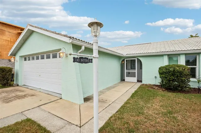 a front view of a house with parking