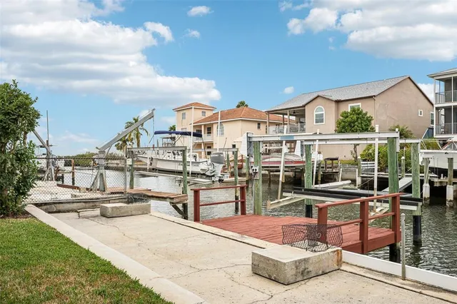 a view of a house with swimming pool and sitting area