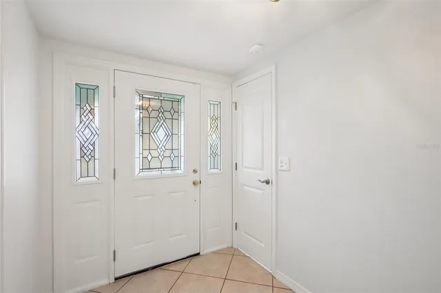 a view of an empty room with closet area