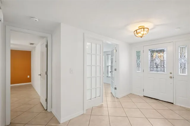 a view of an entryway with front door