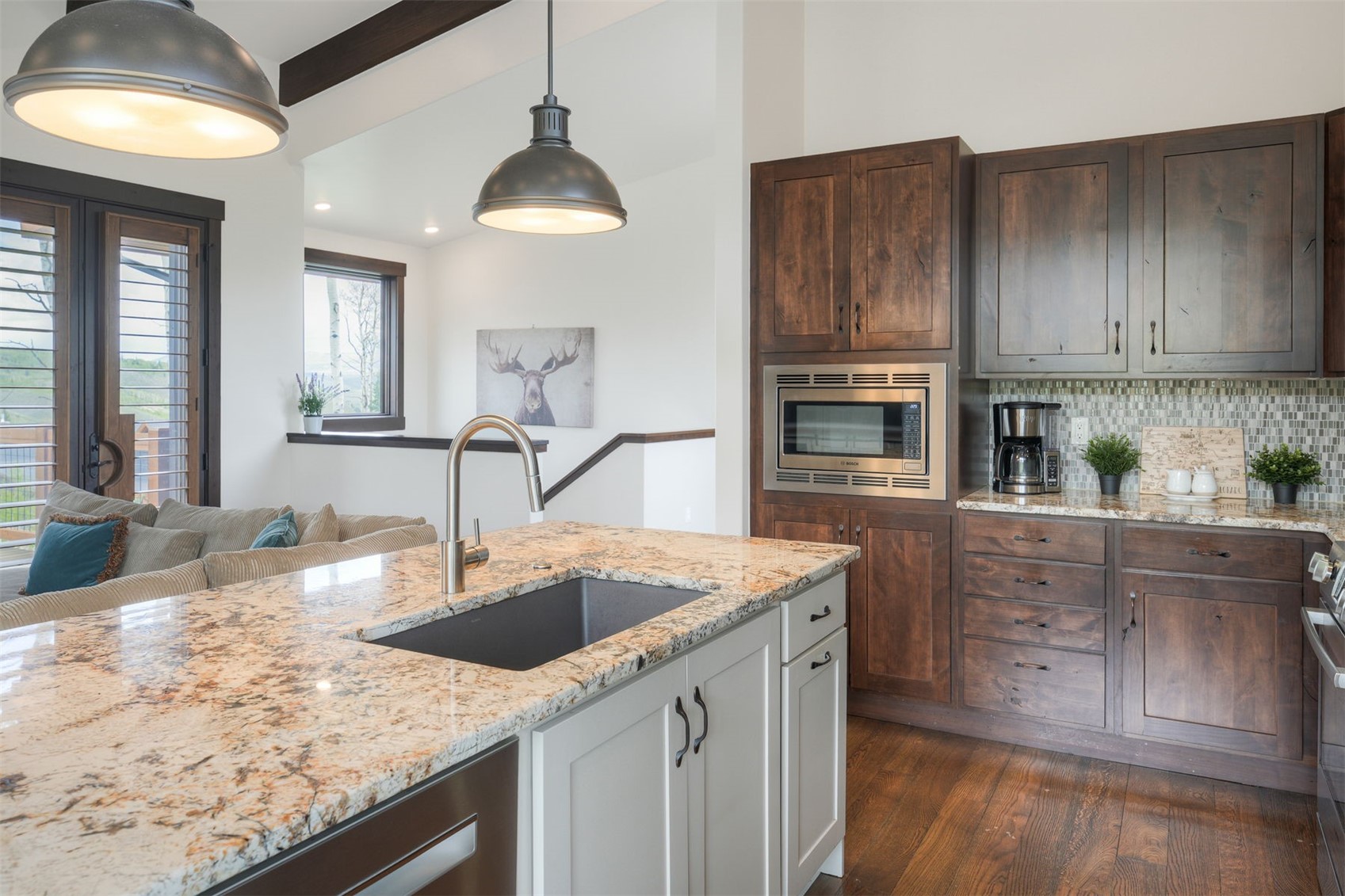 21 Moss Way Silverthorne, CO 80498 - Photo 12 of 50 a kitchen with stainless steel appliances granite countertop a sink a stove and a wooden cabinets