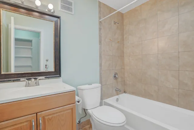 a bathroom with a toilet a sink and a bathtub