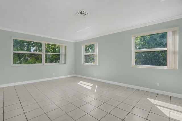 a view of an empty room with a window