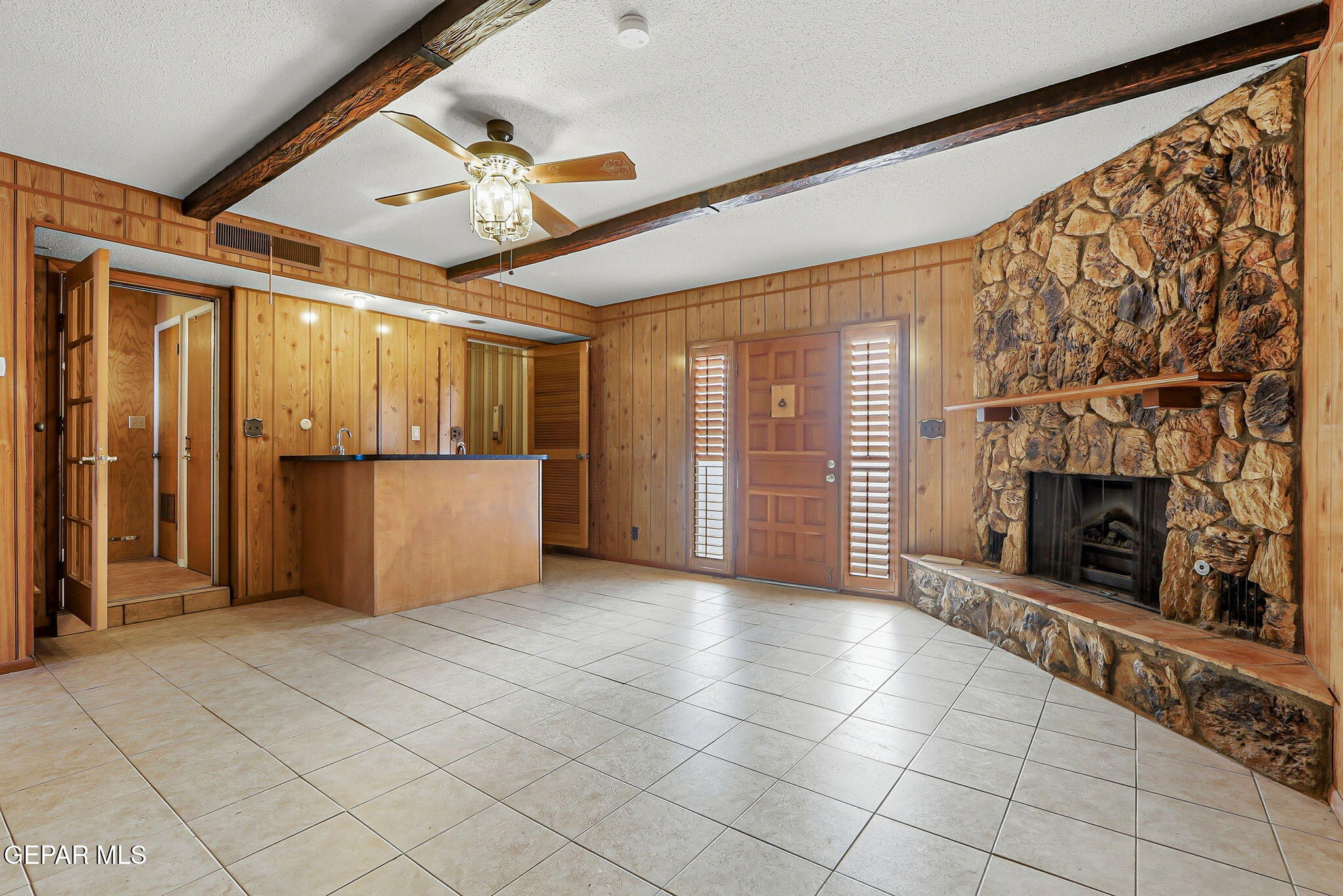 3212 Donegal Road El Paso, TX 79925 - Photo 12 of 37 a view of an empty room with a fireplace and a window