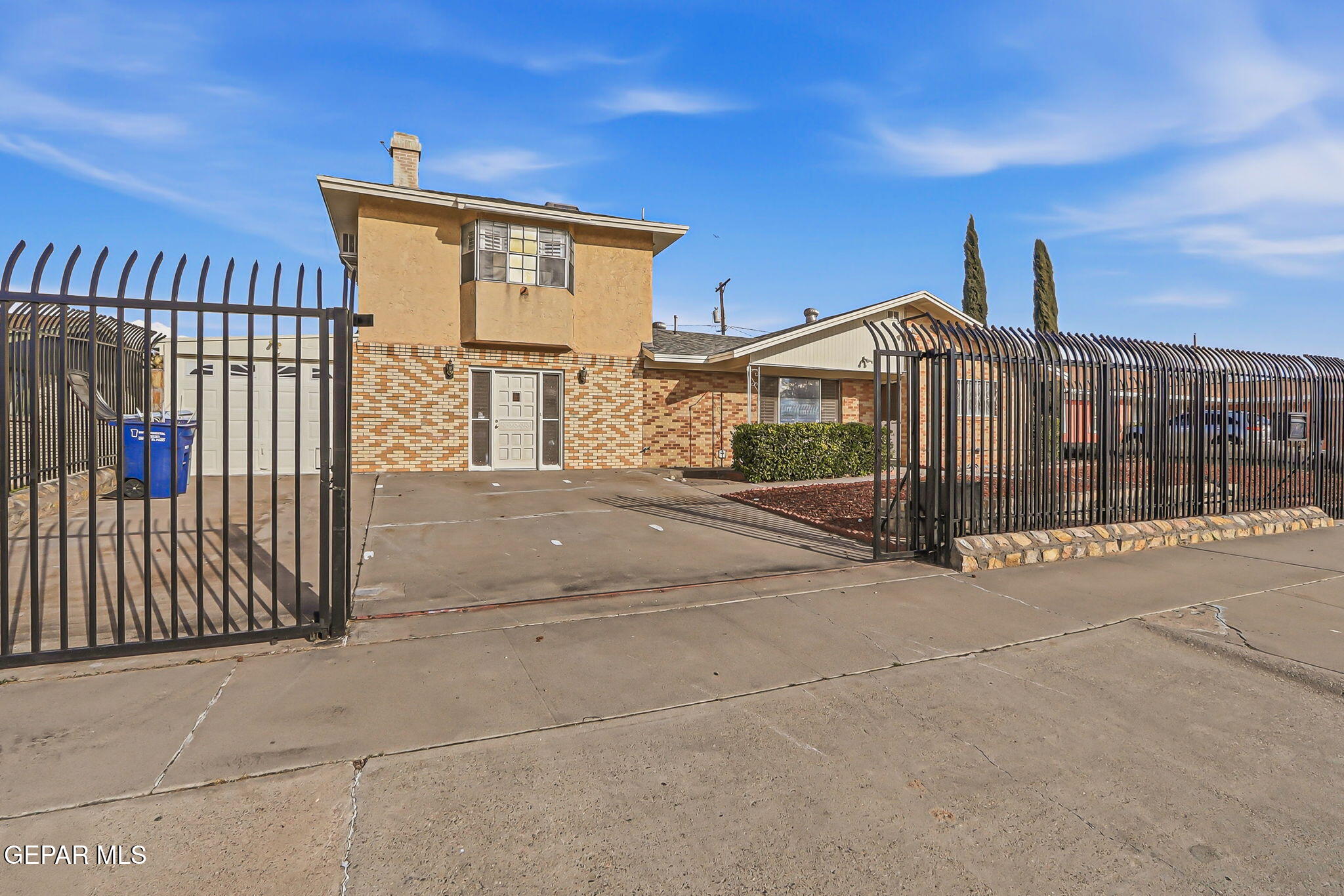 3212 Donegal Road El Paso, TX 79925 - Photo 2 of 40 a view of a house with a wooden fence