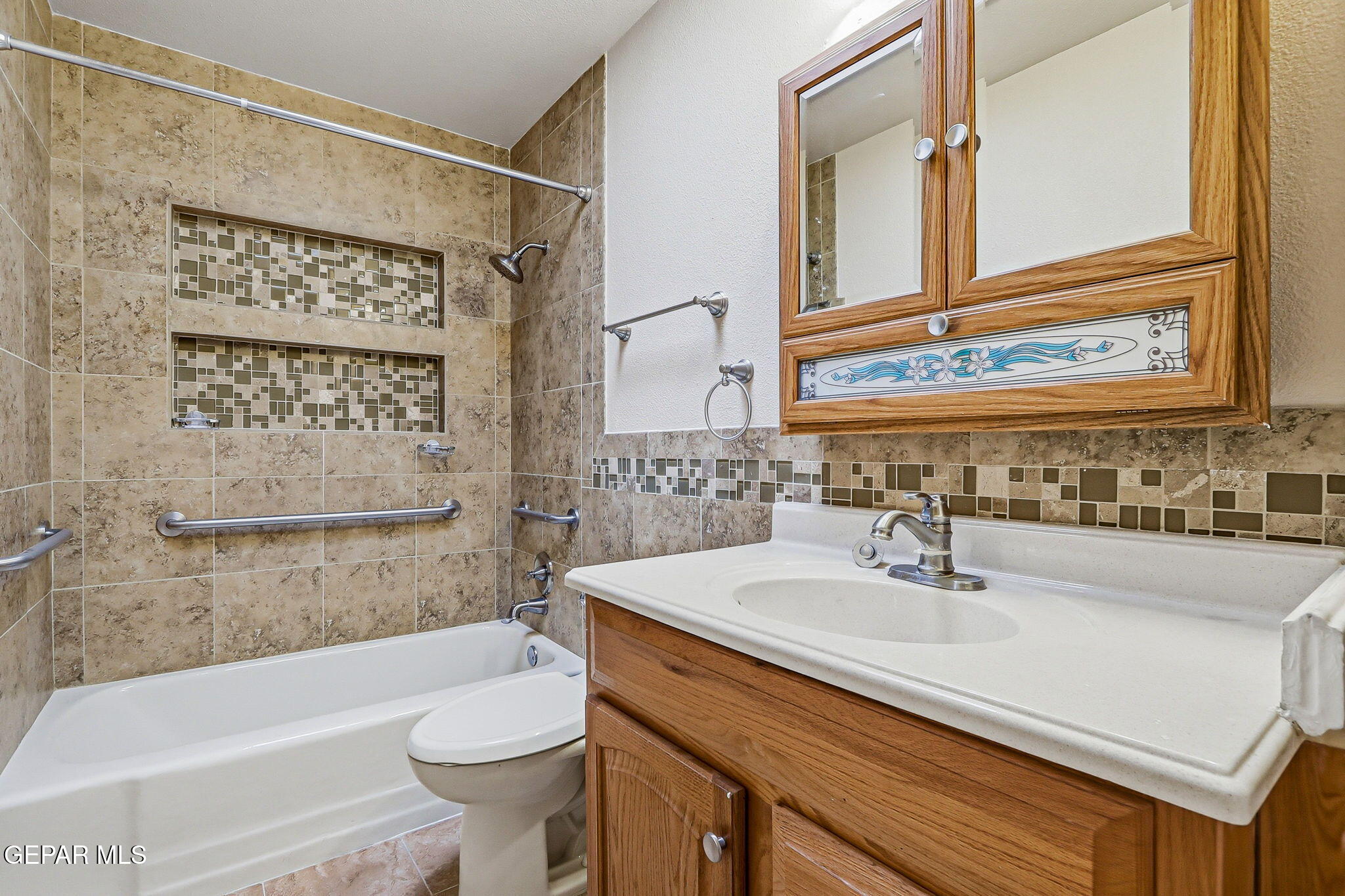 3212 Donegal Road El Paso, TX 79925 - Photo 23 of 37 a bathroom with a sink a toilet and a bathtub