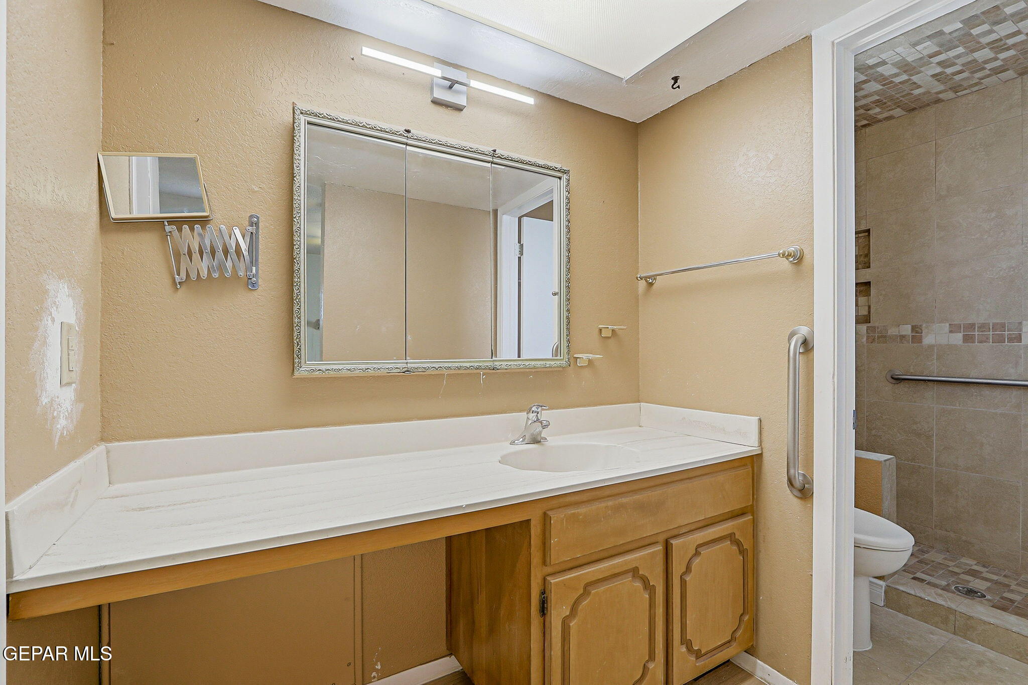 3212 Donegal Road El Paso, TX 79925 - Photo 27 of 37 a bathroom with a sink and a mirror
