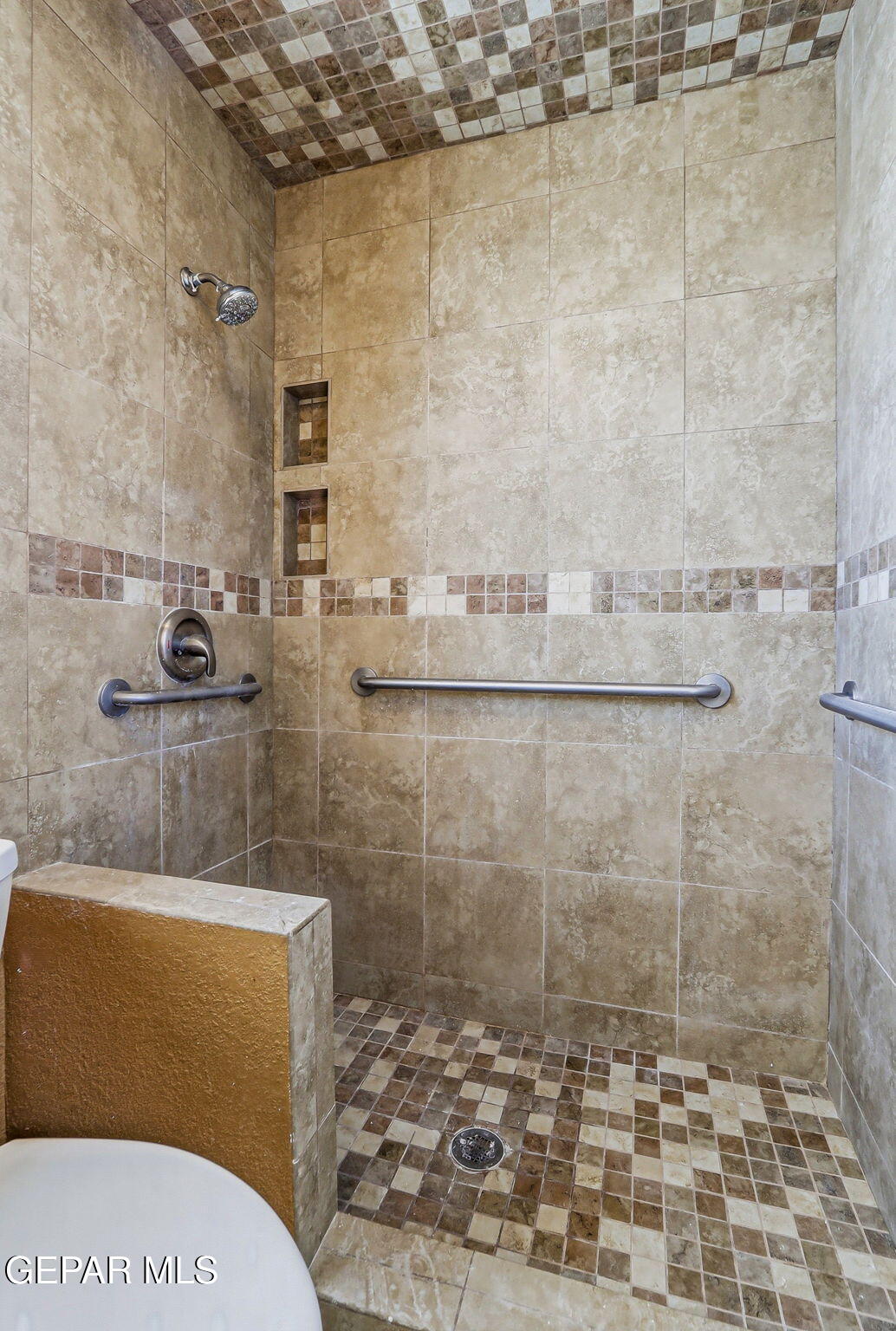 3212 Donegal Road El Paso, TX 79925 - Photo 28 of 37 a bathroom with a toilet and a shower