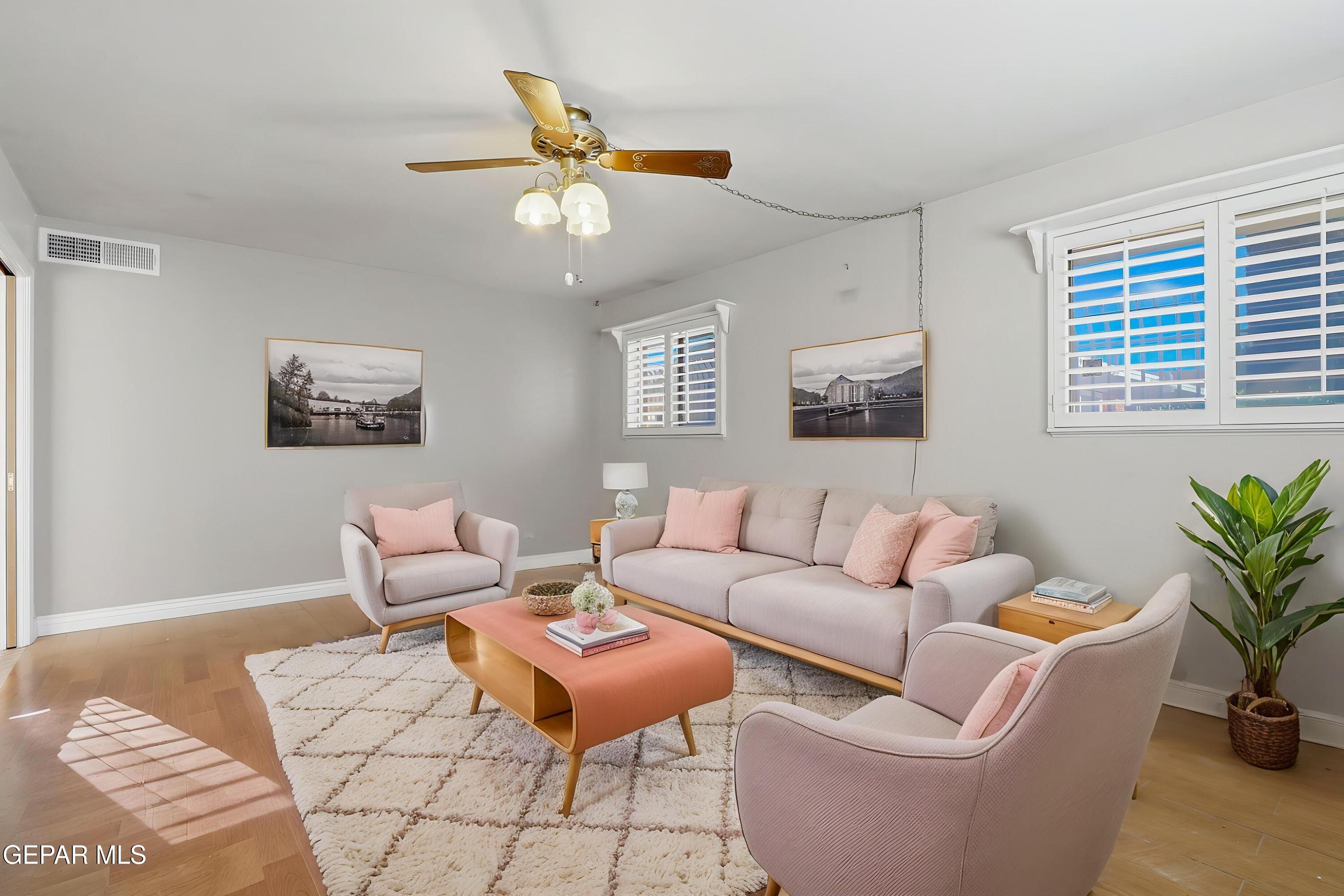 3212 Donegal Road El Paso, TX 79925 - Photo 3 of 40 a living room with furniture a ceiling fan and a window