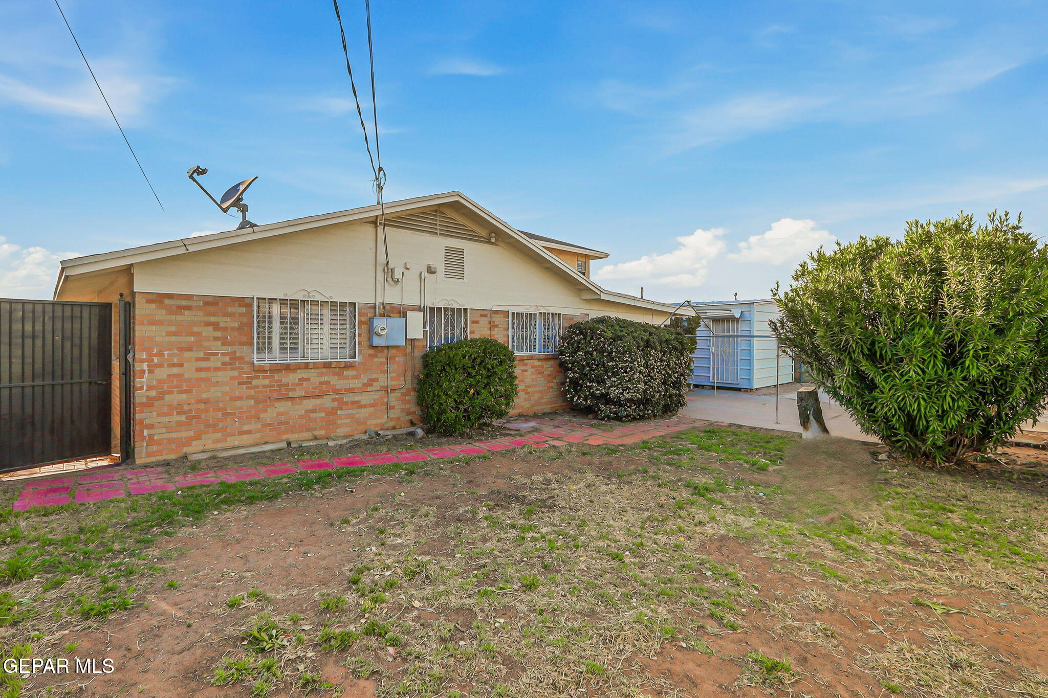 3212 Donegal Road El Paso, TX 79925 - Photo 36 of 40 a front view of a house with a yard and garage