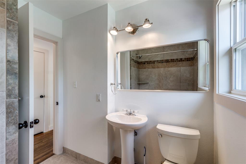 2012 Payne Avenue, Unit A Austin, TX 78757 - Photo 18 of 33 Bathroom featuring a pedestal sink, toilet, and a window for natural light
