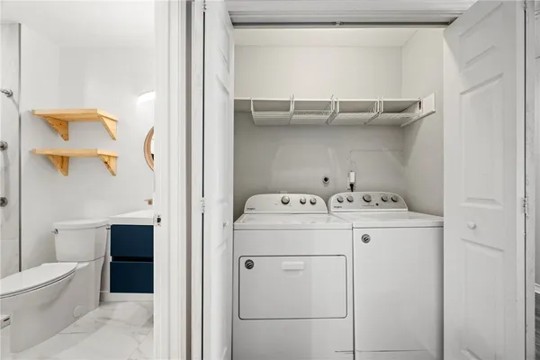 a utility room with dryer and washer