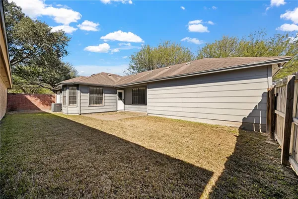 a house view with a backyard space