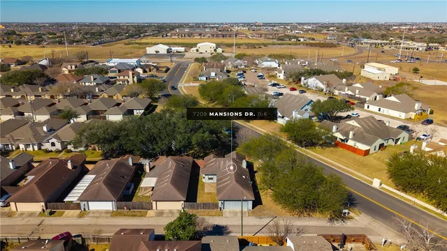 an aerial view of residential building with outdoor space and river