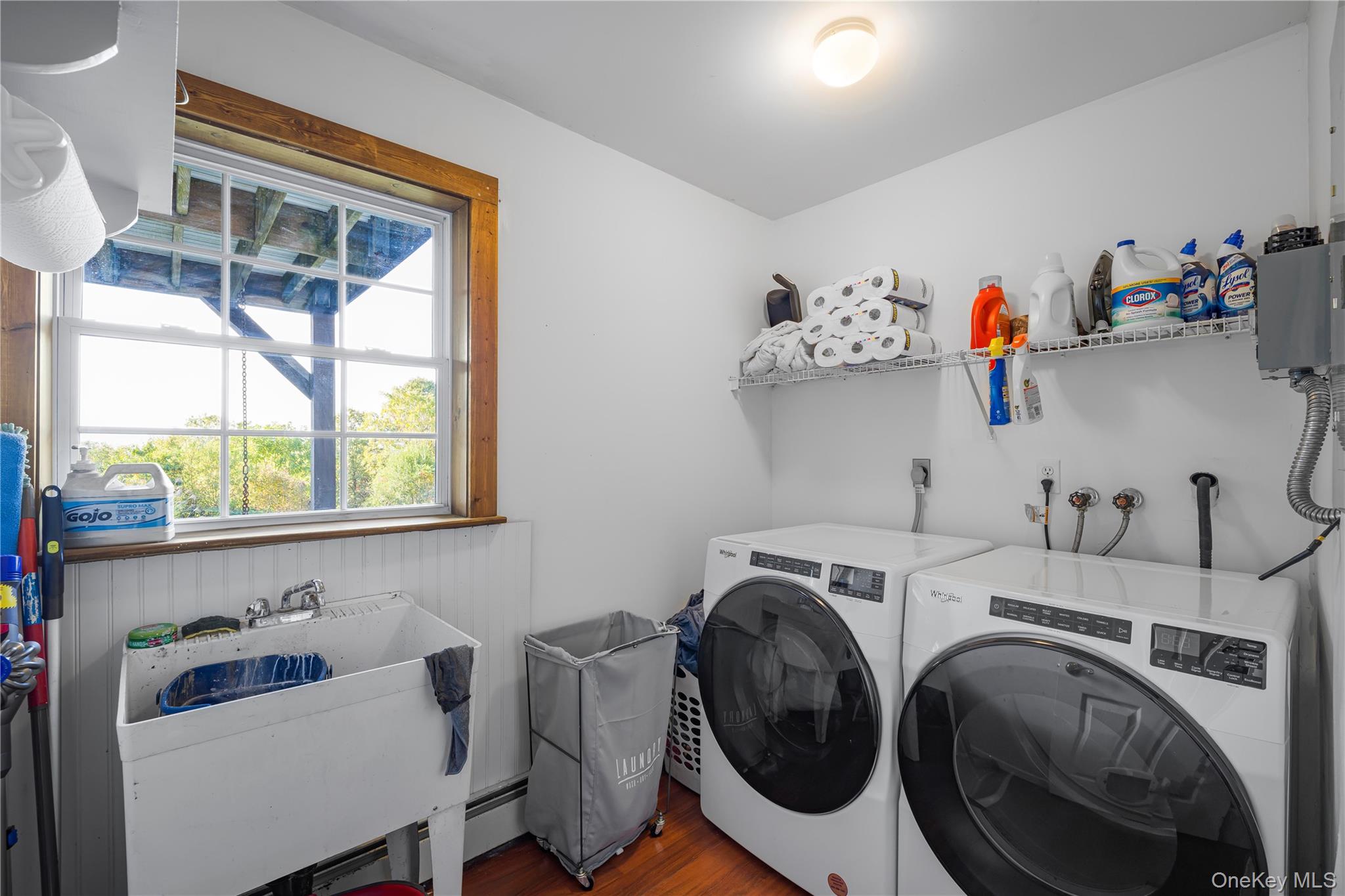 17 Brendella Court Wallkill, NY 12589 - Photo 22 of 42 Washroom featuring wood finished floors, washing machine and dryer, and a baseboard heating unit