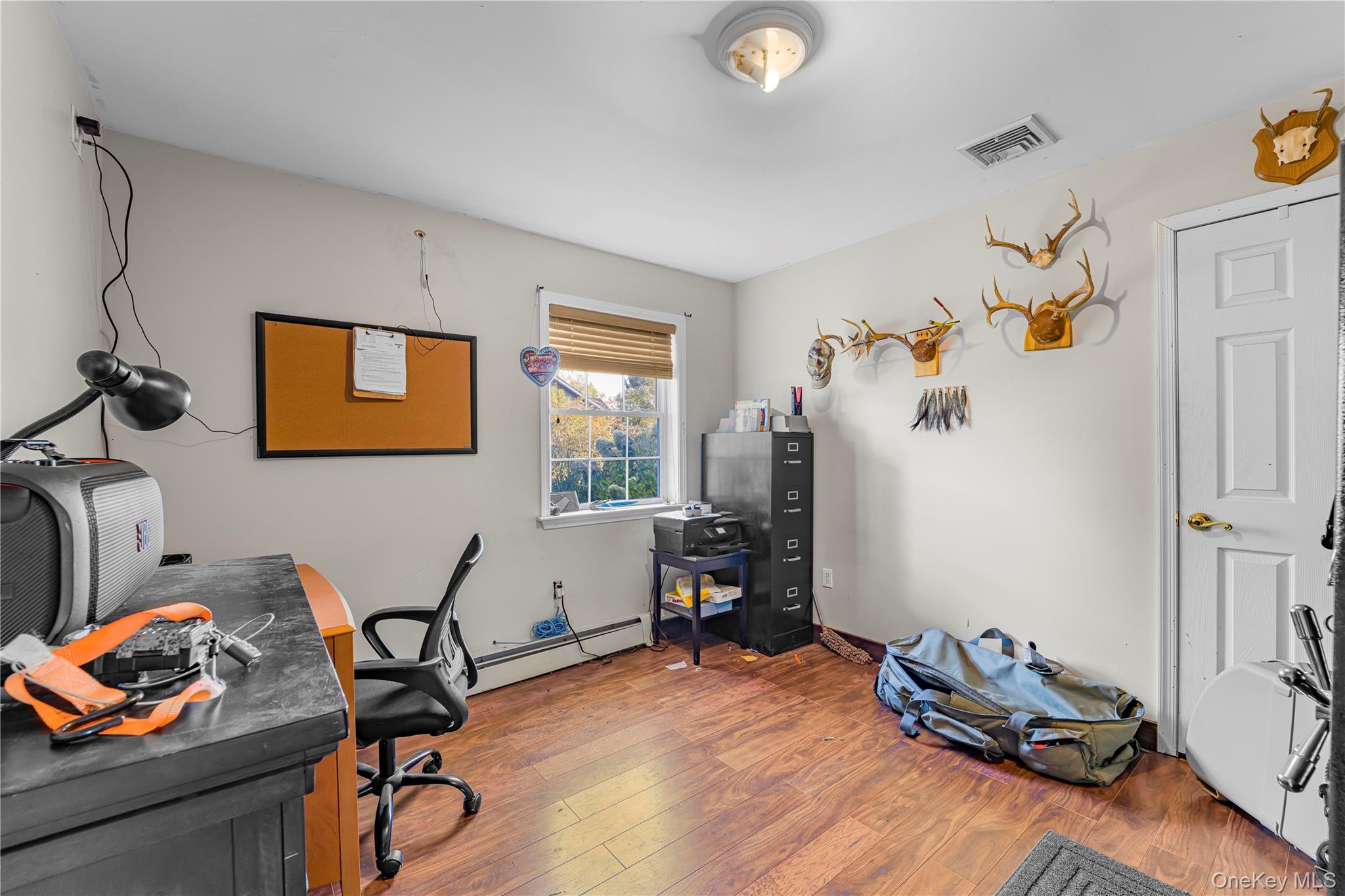 17 Brendella Court Wallkill, NY 12589 - Photo 23 of 42 Office area featuring wood finished floors and baseboard heating