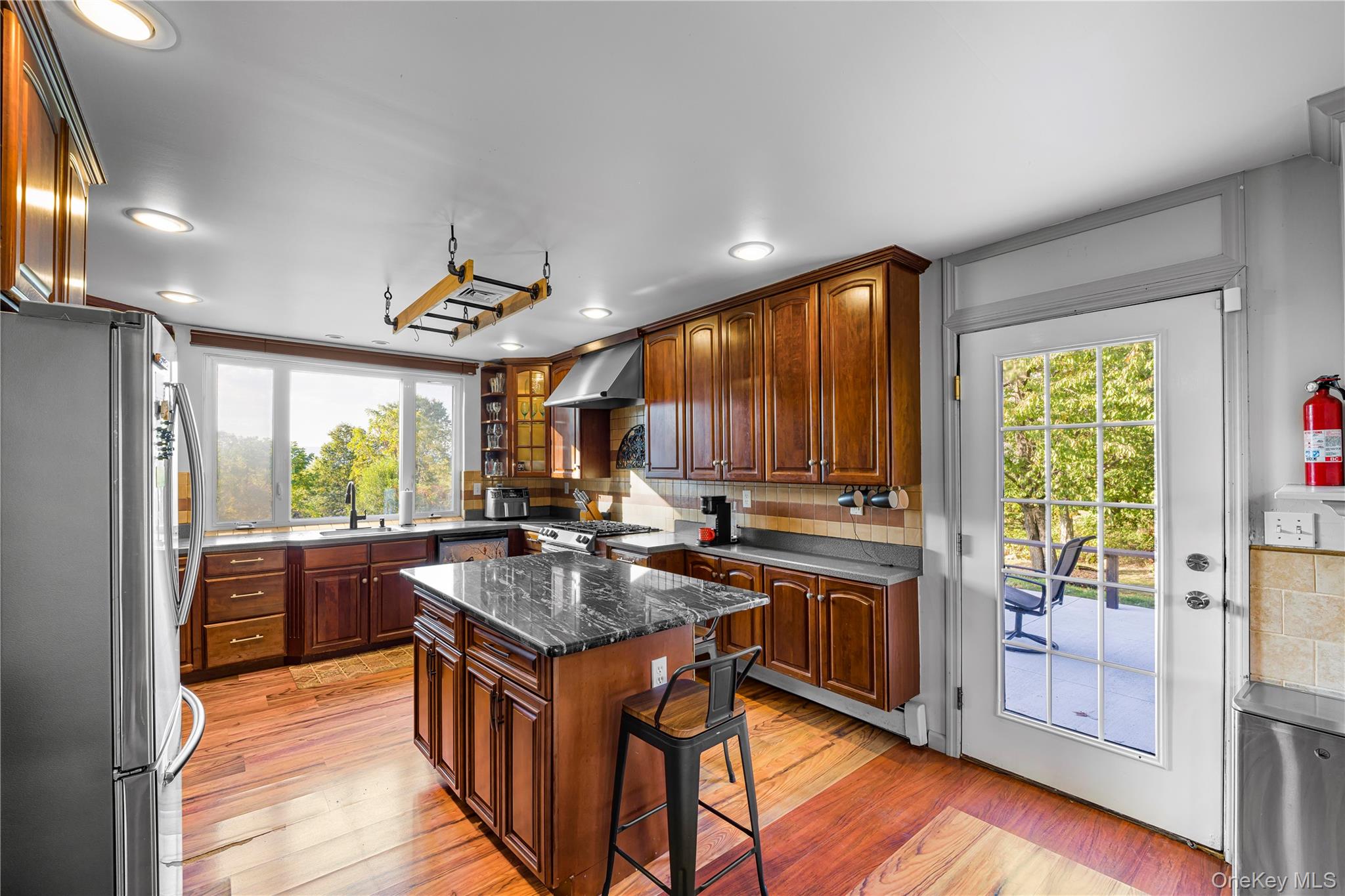 17 Brendella Court Wallkill, NY 12589 - Photo 5 of 42 Kitchen featuring decorative backsplash, a breakfast bar area, stainless steel appliances, light wood-type flooring, and recessed lighting