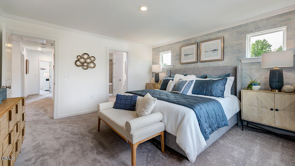 236 Hank Way Angier, NC 27501 - Photo 12 of 49 a spacious bedroom with a bed and a couch