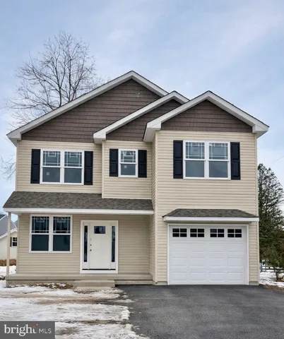 a front view of a house with a garage