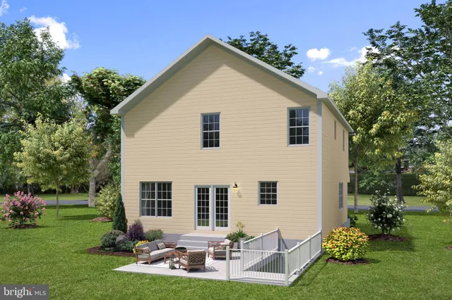 a view of a house with backyard sitting area and garden