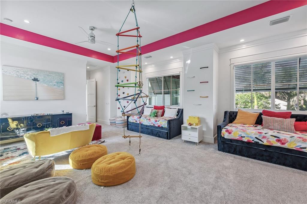 1829 South Inlet Drive Marco Island, FL 34145 - Photo 22 of 46 a bedroom with furniture and a chandelier