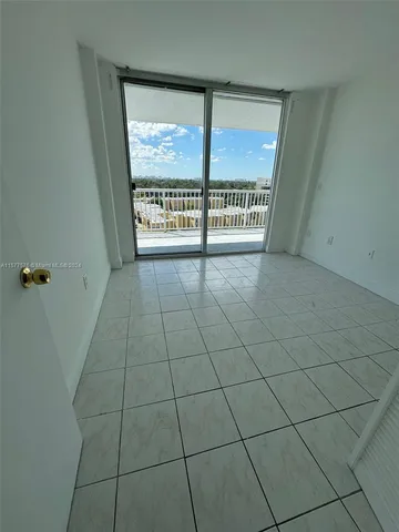 a view of balcony with wooden floor and a potted plant