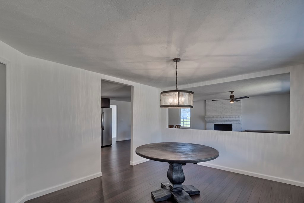 411 Redds Branch Road Aiken, SC 29801 - Photo 2 of 25 a view of a room with a chandelier and wooden floor