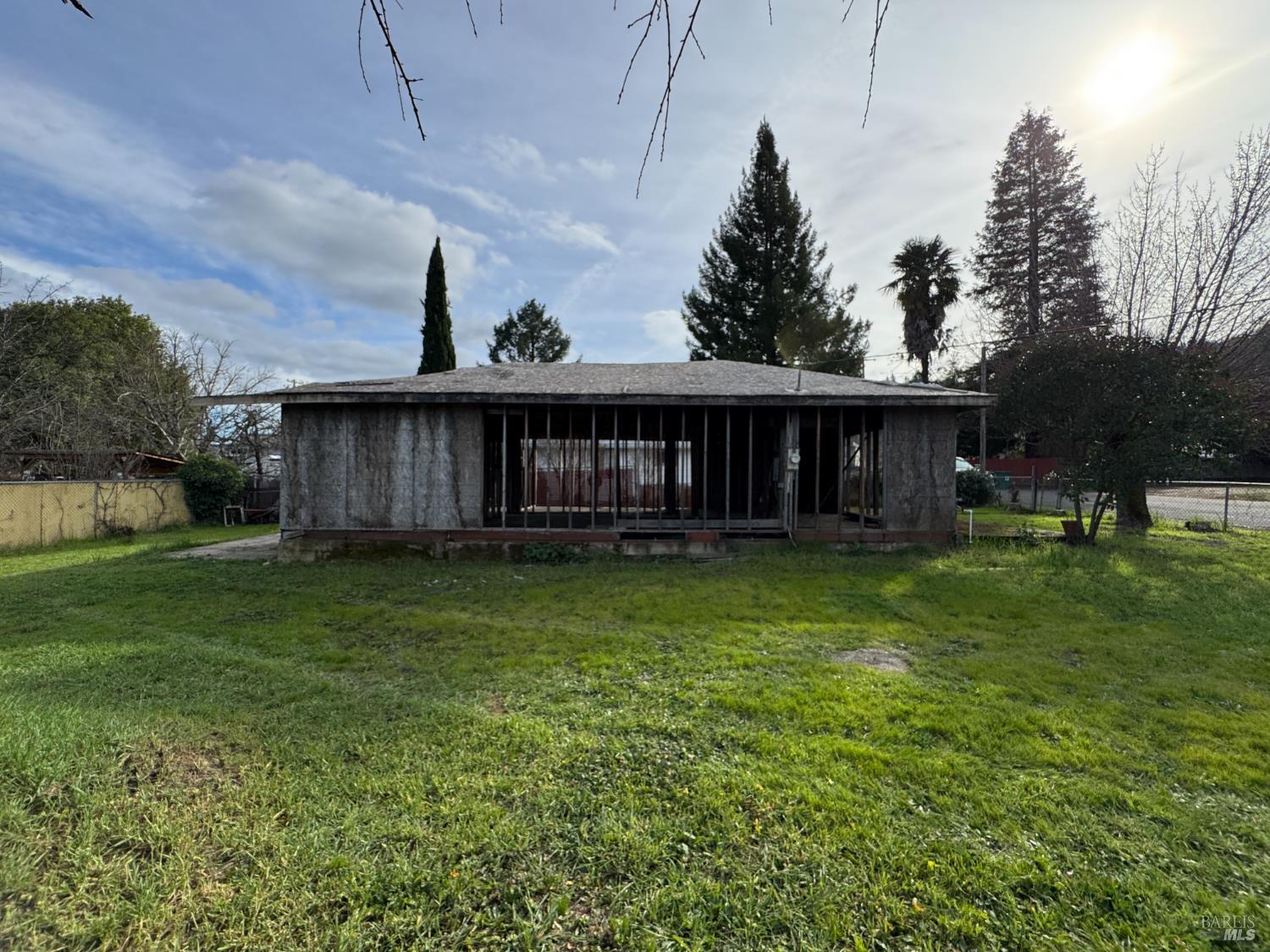 a view of a house with a yard