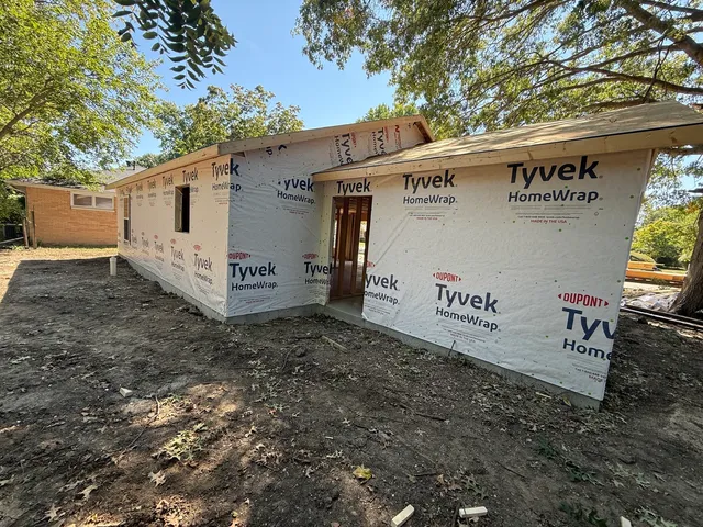 a view of a backyard of the house