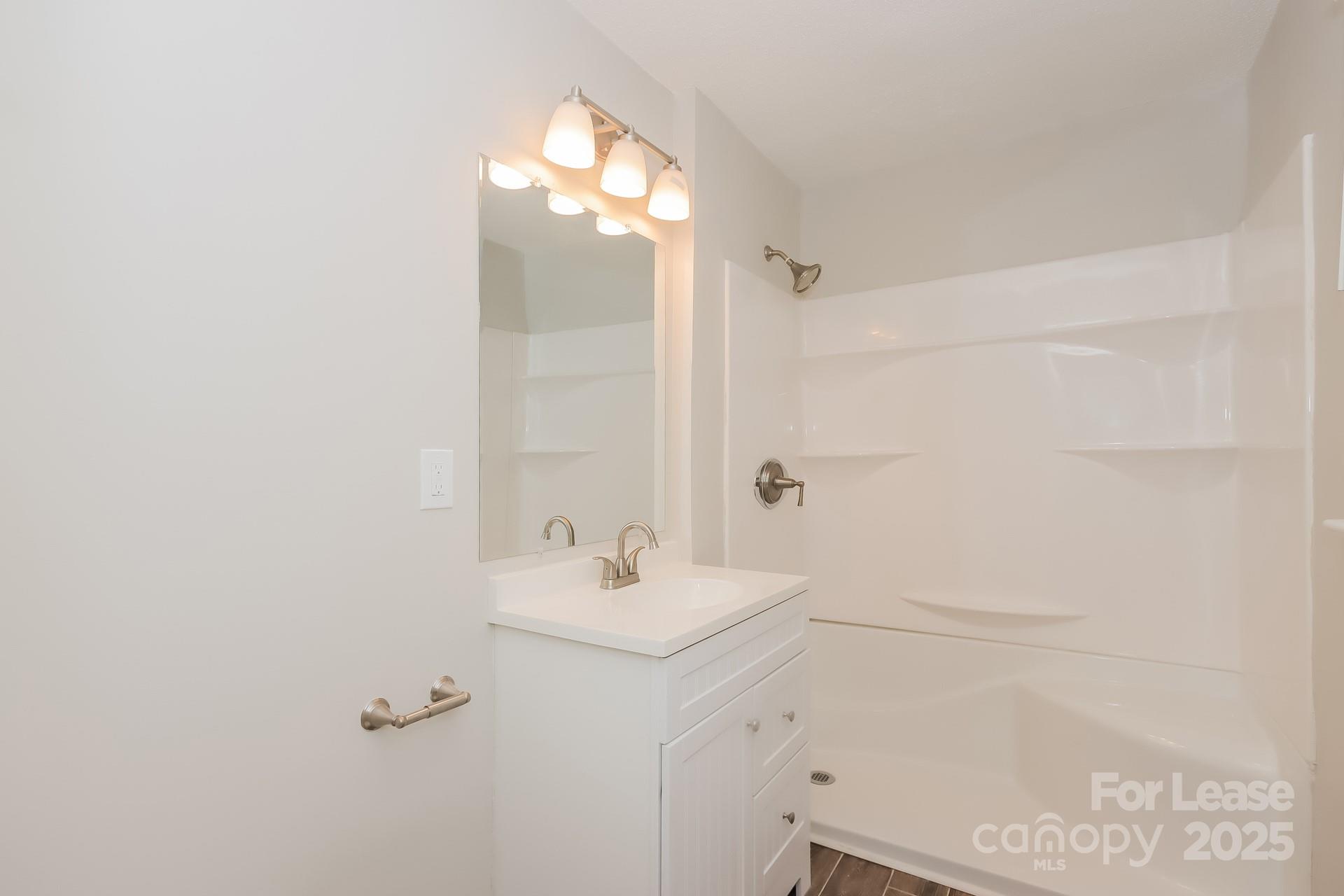 1135 Carolina Circle Statesville, NC 28677 - Photo 10 of 16 a bathroom with a sink mirror and vanity