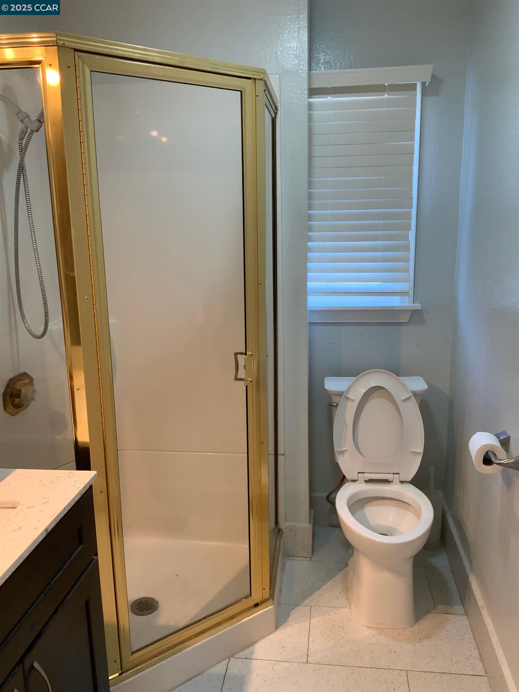 2680 Appian Way Pinole, CA 94564 - Photo 16 of 31 a bathroom with a toilet a sink and a shower