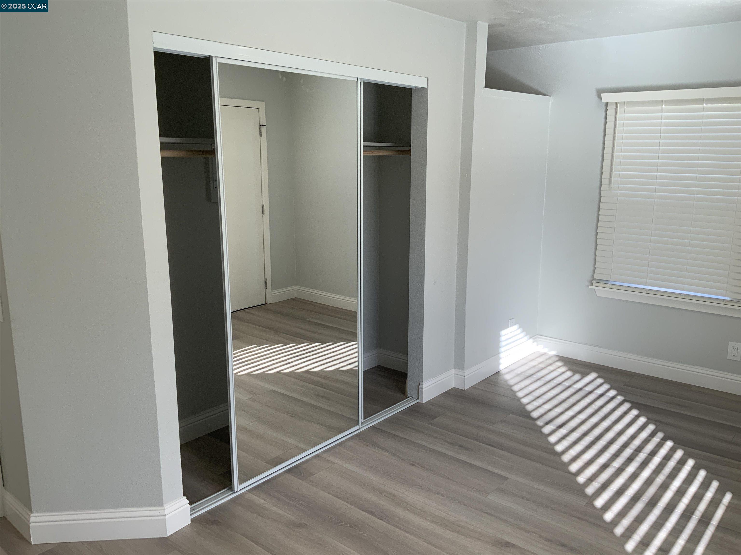 2680 Appian Way Pinole, CA 94564 - Photo 17 of 31 a view of empty room with wooden floor