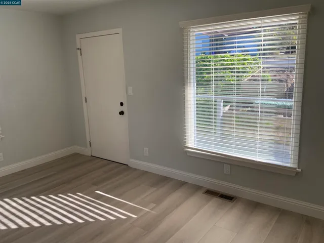 a view of a room that has a window in it