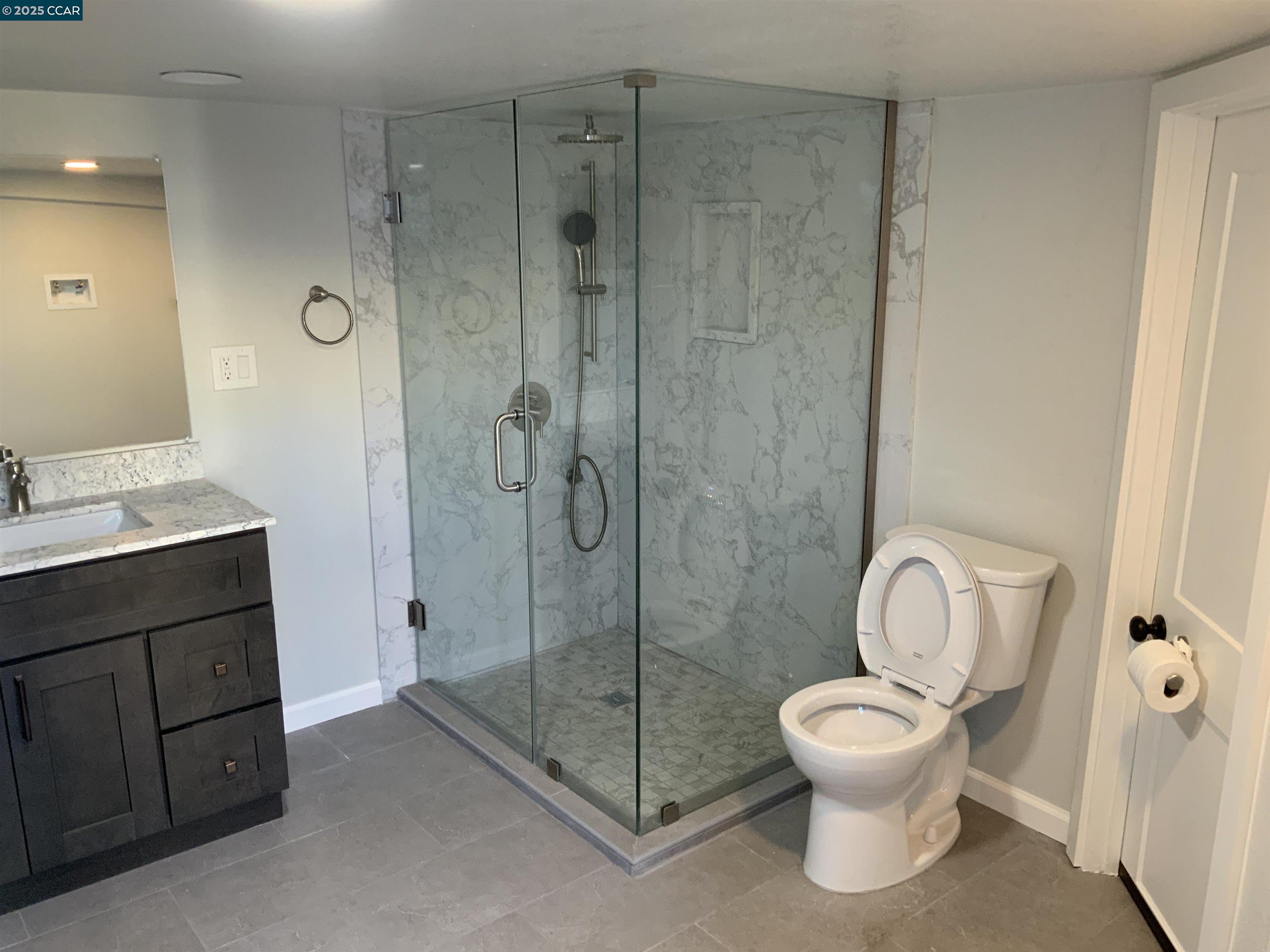 2680 Appian Way Pinole, CA 94564 - Photo 2 of 31 a bathroom with a toilet sink and shower