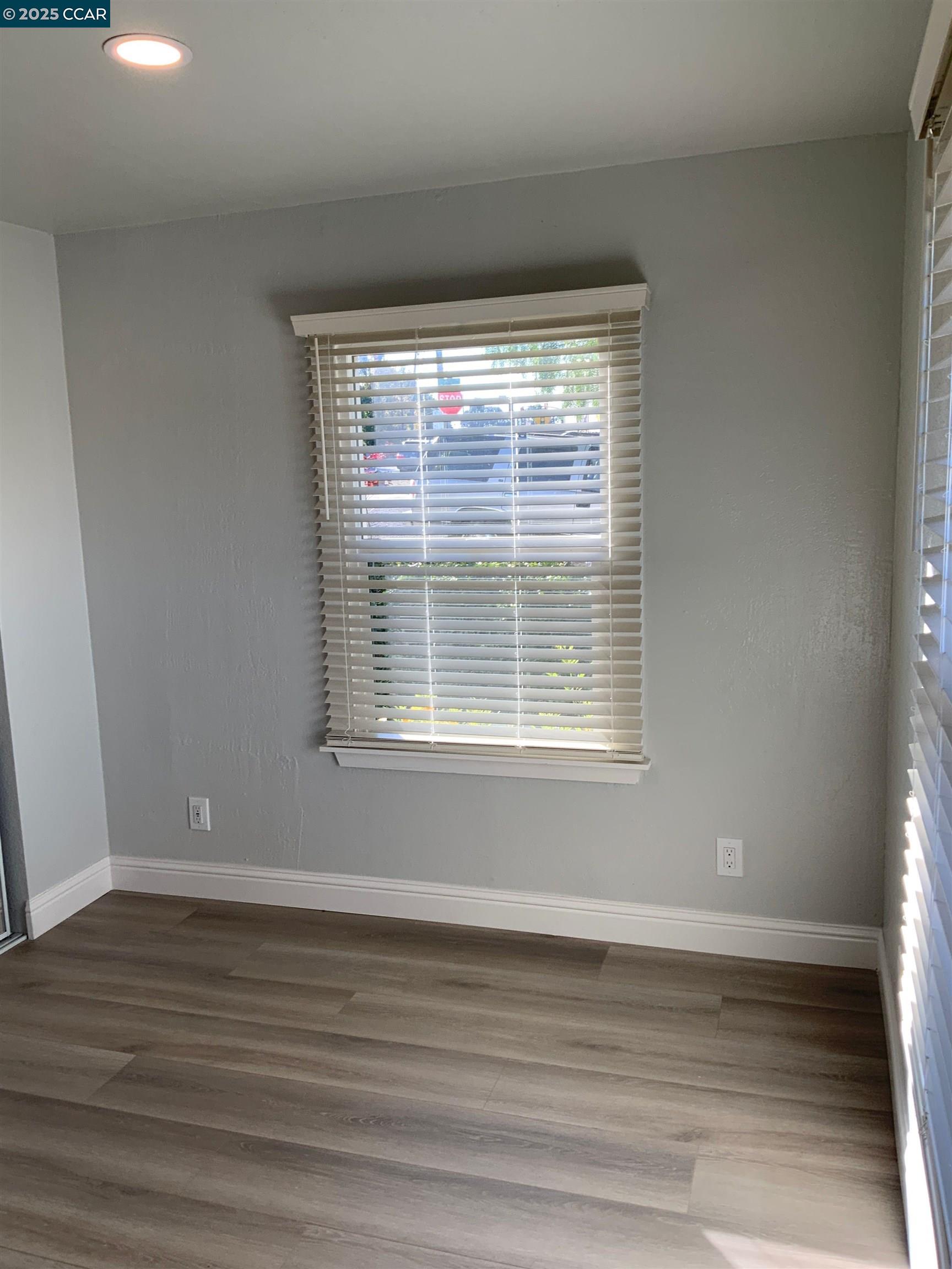 2680 Appian Way Pinole, CA 94564 - Photo 27 of 31 a view of an empty room with wooden floor and a window
