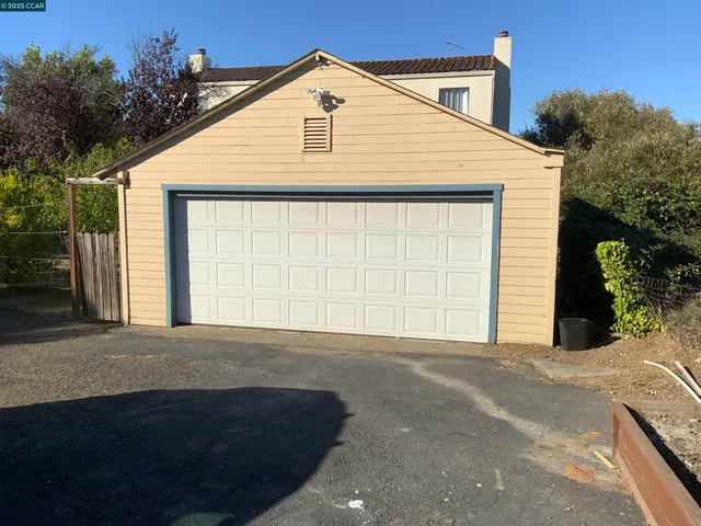 a front view of a house with a garage